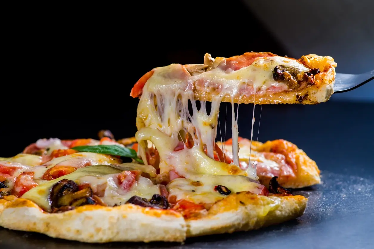 Close-up of melted cheese on a pizza