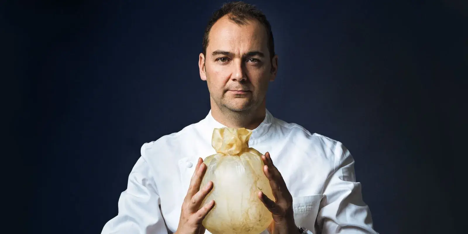 Portrait of the head chef of Golden Crust.